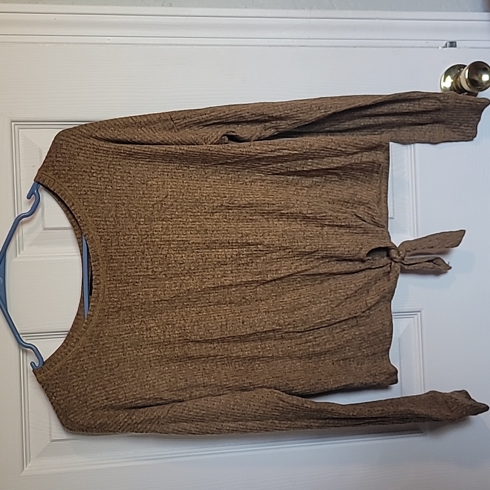 Lightweight,dark tan, medium women's knit shirt with a cute tie in the front.